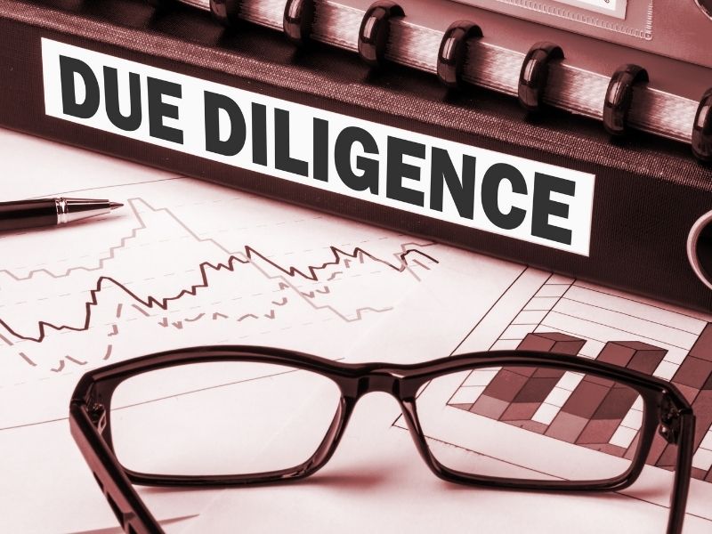 Due diligence concept showing business documents, charts, and planning tools used in land development and site evaluation