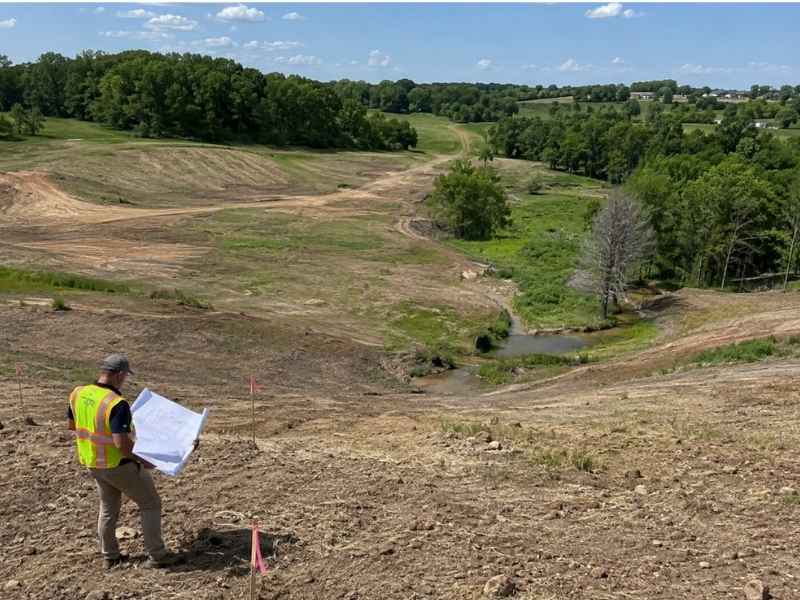 Land planning review of existing terrain, slopes, drainage paths, and site conditions in Charlotte, North Carolina.
